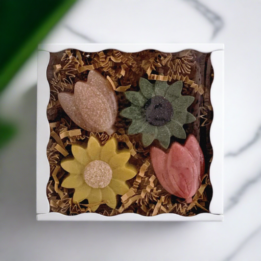a box of 4 floral goat milk hand soaps