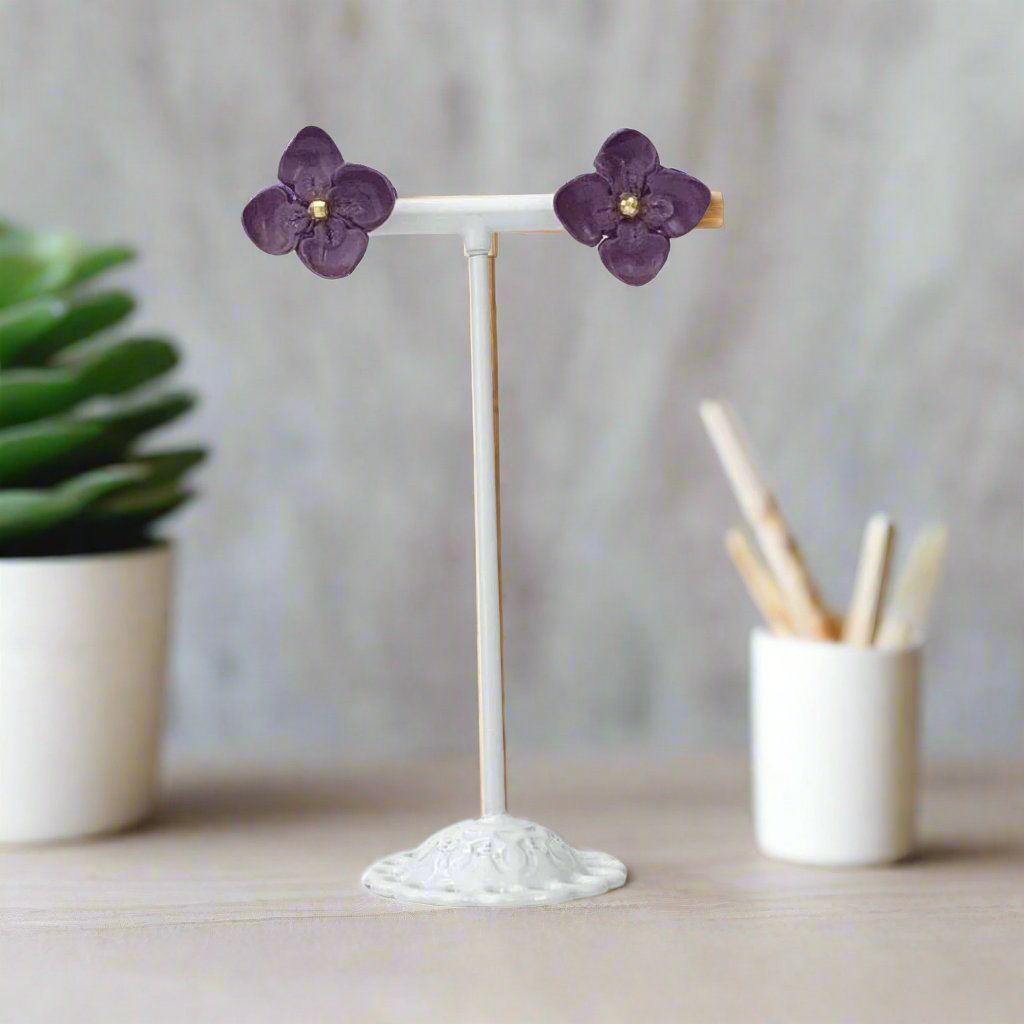 Dark purple flower clay earring studs display