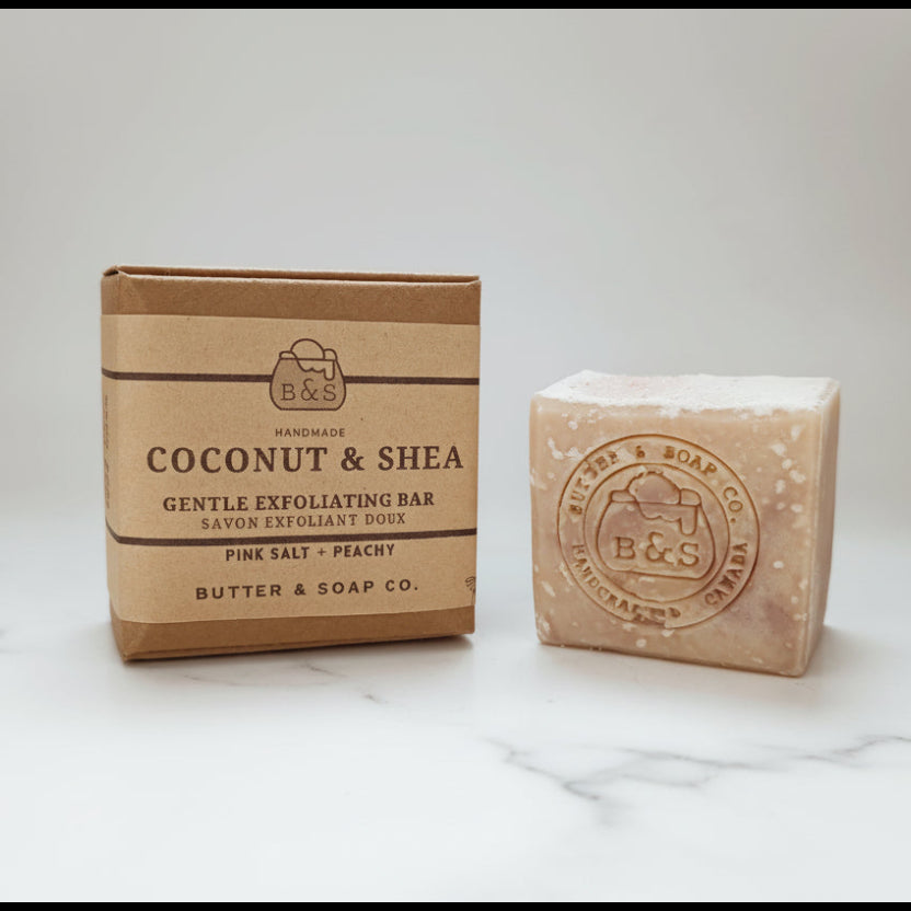 Butter & Soap Co. coconut and shea bar soap with packaging on a white marble counter background